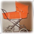 duży pomarańczowy wózek dla lalek