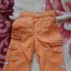 Świetne spodnie pomarańczowe CHEROKEE12 18mies