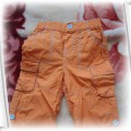 Świetne spodnie pomarańczowe CHEROKEE12 18mies