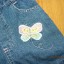 jeansowe spodenki z motylkiem 122 128
