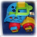 grająca wywrotka Fisher Price z klockami