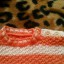 Sweterek w paski biało pomarańczowe