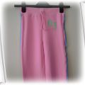Różowe spodnie kolorowe paski 6 l 116 cm