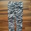 H&M legginsy spodnie zebra 122 6 7 lat